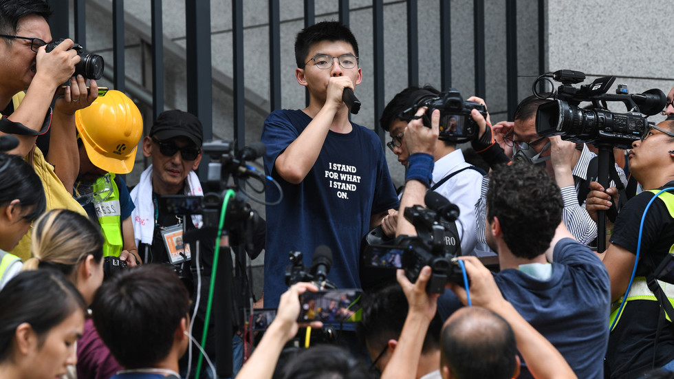Joshua Wong at a protest outside police headquarters in Hong Kong, June 2019. AFP Anthony Wallace
