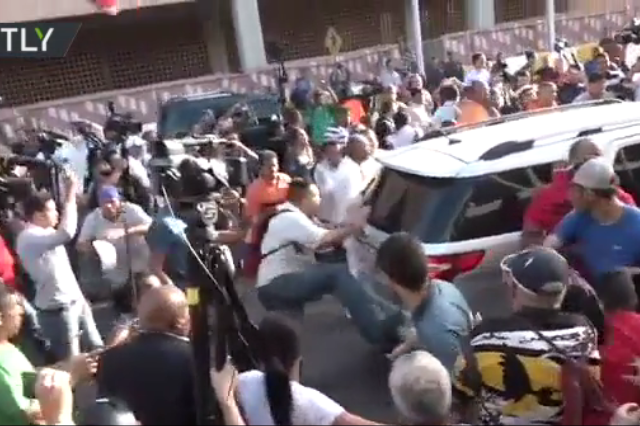 ‘Murderer!’ Protests and fights erupt as Guaido arrives at Venezuelan airport, gets booed and DOUSED with water (VIDEOS)