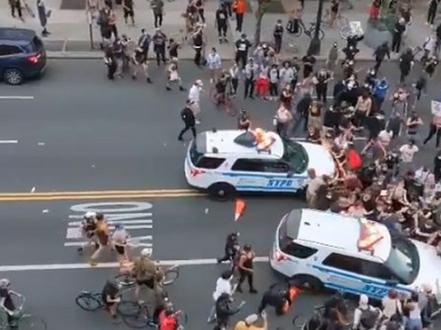 NYPD police cruisers RUN INTO crowds of protesters in terrifying video