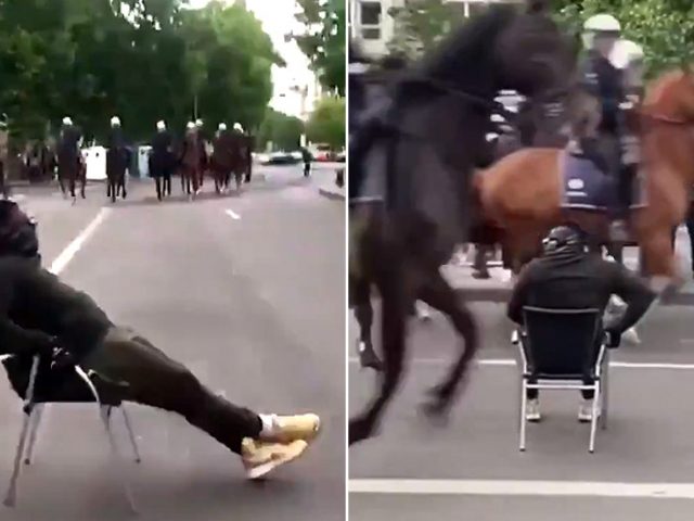 WATCH protester chilling in lounge chair as mounted police charge at him at Brussels BLM protest