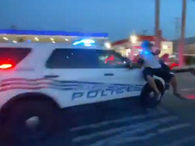 Detroit police filmed driving SUV through crowd of protesters in blood-chilling VIDEO