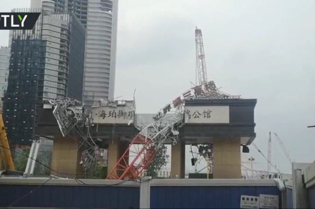 WATCH: Several injured as giant crane COLLAPSES on busy road in Wuhan