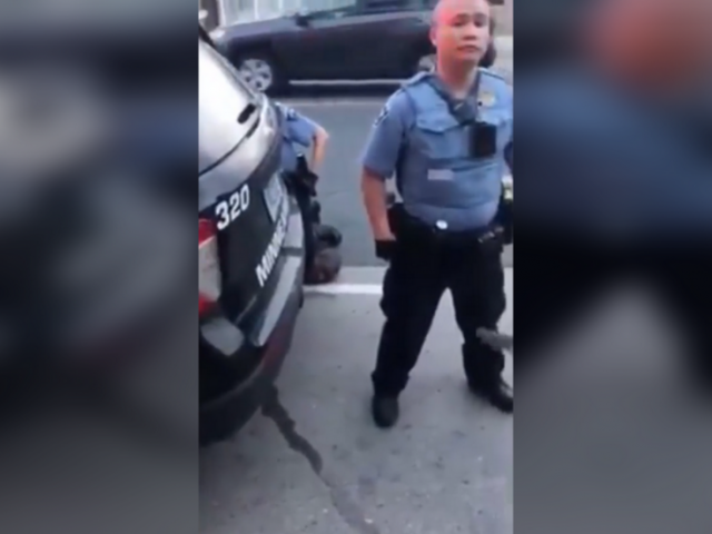 Disturbing NEW VIDEO shows cop standing guard as George Floyd dies