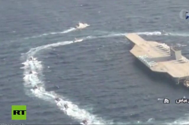 Watch Iran fire missile & overtake mock US aircraft carrier during Strait of Hormuz war games (VIDEO)