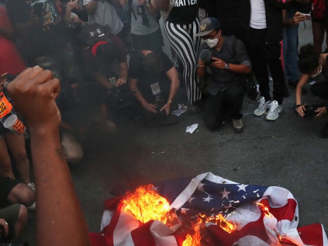 ‘F**k the American flag’: WATCH BLM protesters stomp on & BURN US flag outside White House (VIDEO)