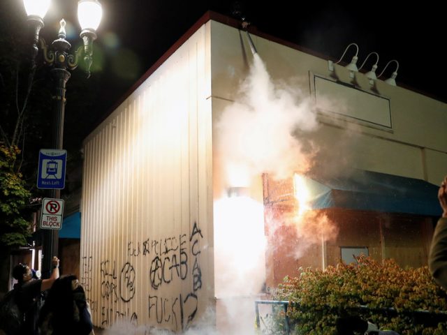 ‘Burn baby, burn!’: WATCH Portland protesters cheer after police precinct set ablaze on 88th night of rioting