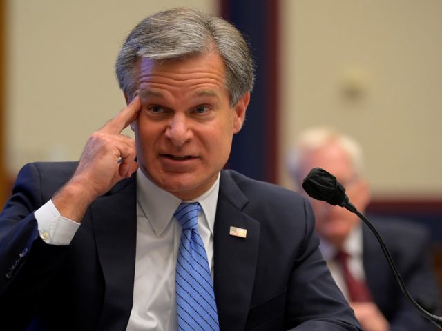 FBI director says Russia is engaged in ‘very active efforts’ to sink Biden & rehashes 2016 claims… but provides no evidence