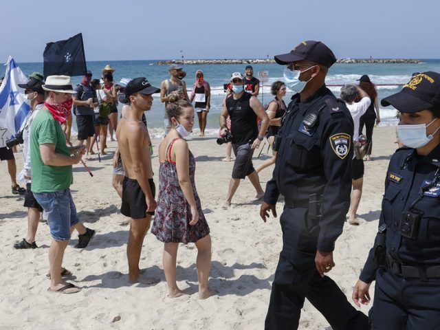 Bikini-clad Israelis rally against Covid-19 lockdown at Tel Aviv BEACH protest (PHOTOS, VIDEOS)