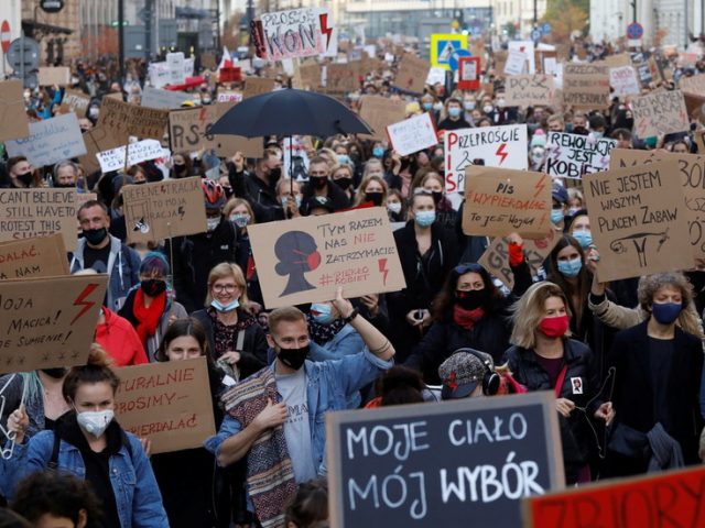 Poland’s national women’s strike sees mass walkouts in opposition to near-total abortion ban