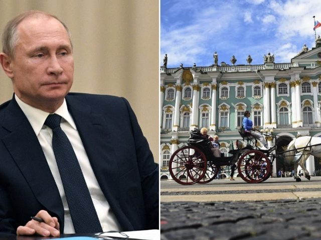 Kremlin unconcerned after liberal opposition politician rips photo of Putin off council building wall & tears it to pieces