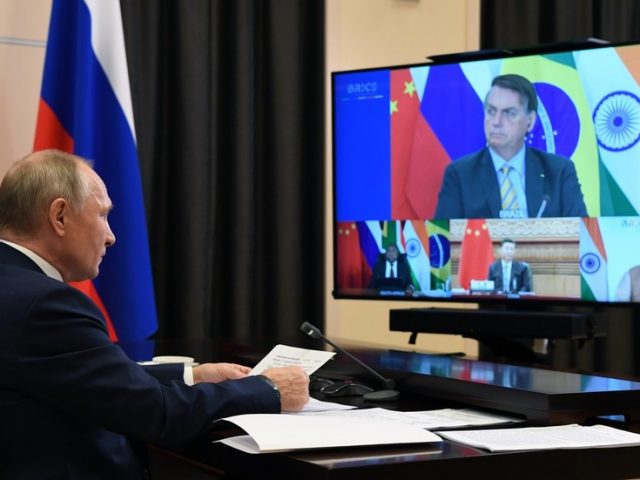 Putin uses BRICS summit to call for lifting of sanctions on poorer countries devastated by coronavirus pandemic