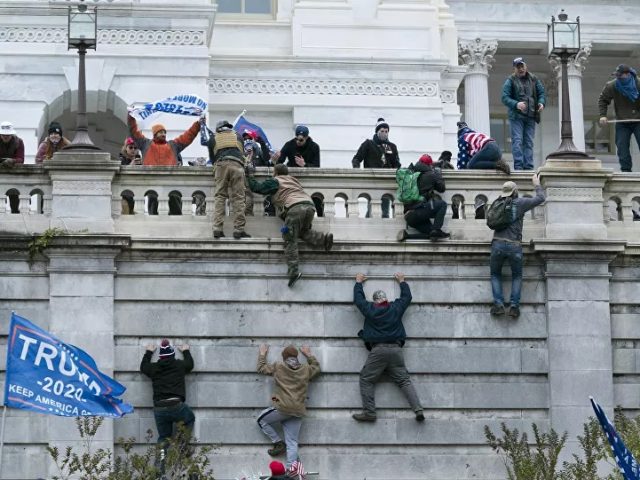 Videos: Protesters Climb Onto Inauguration Structures Amid Capitol Clashes