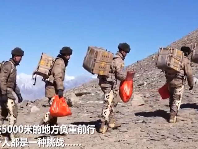Ho-ho-hiss: Chinese troops in EXOSKELETONS deliver New Year presents to Himalayan outpost (VIDEO)