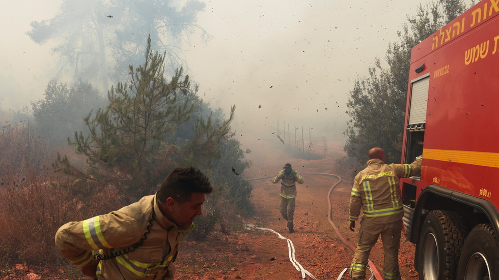 Scores of Israeli firefighters