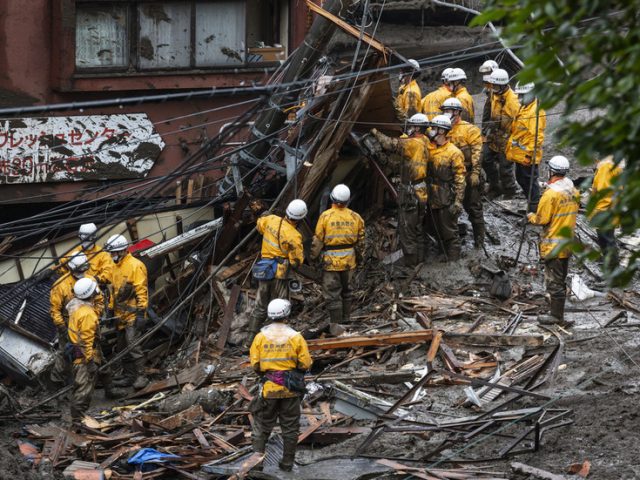 1,500 rescuers wade through mud to find survivors in wake of catastrophic landslide in Japan