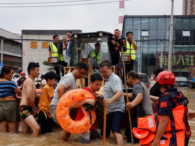 Hundreds of thousands evacuated from areas devastated by floods as China death toll rises to 33 and more rain forecast (VIDEO)