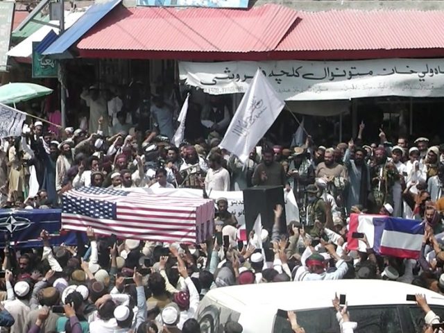 Taliban hold mock ‘funeral’ for NATO, take Black Hawk helicopter for joyrides, and show off loot at Kabul airport after US retreat