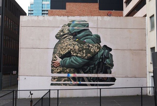 Aussie artist pressured to paint over peace mural