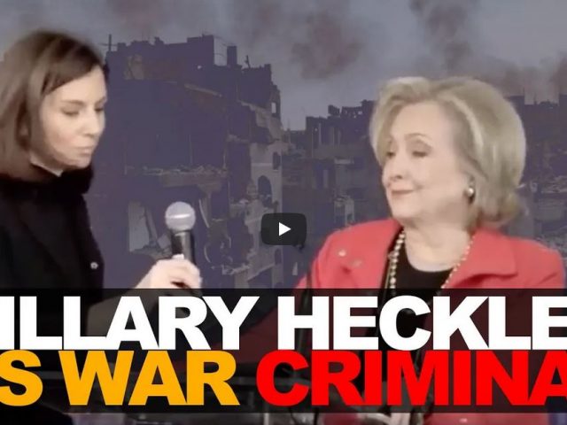 Hillary heckled as war criminal
