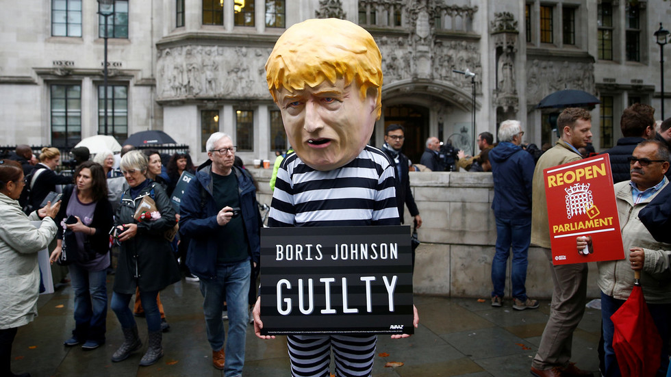 A protester stands outside the Supreme Court © Reuters Henry Nicholls