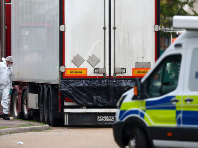 Police are seen at the scene where bodies were discovered in a lorry container, in Grays, Essex, Britain October 23, 2019 UK Lorry Migrants Left ‘Bloody Handprints’ Inside Container After Desperately ‘Banging for Help’