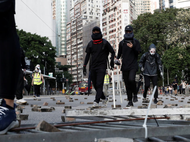 Hong Kong protesters vandalize & set fire to Xinhua news agency office (PHOTOS)