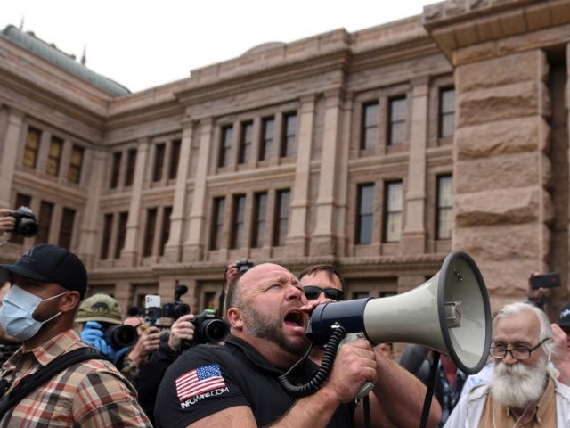‘Fire Fauci, let us work’: No social distancing as Alex Jones joins hundreds in rally against Covid-19 lockdown measures in Texas