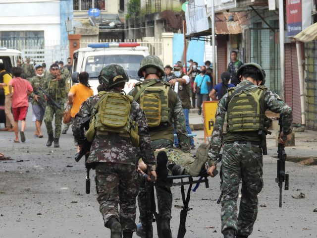 Soldiers and civilians killed in blasts at food plaza and church in southern Philippines (PHOTOS)