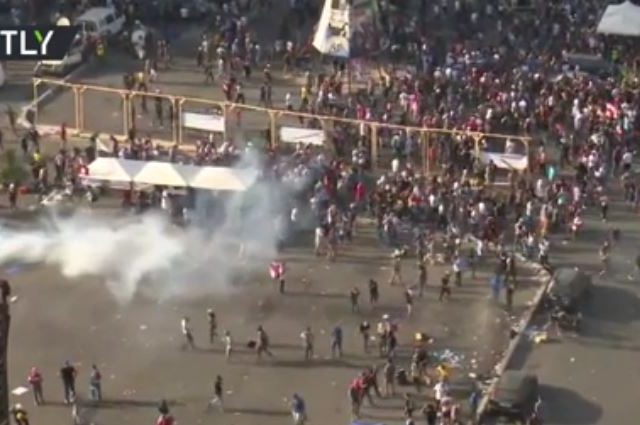 Police deploy tear gas as Lebanon protesters try to break into parliament building following massive Beirut explosion