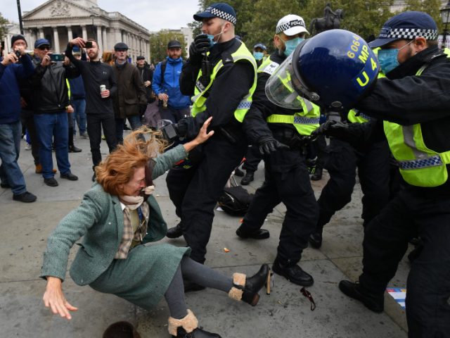 WATCH: London police slam woman to the ground during anti-lockdown protest in Trafalgar Square