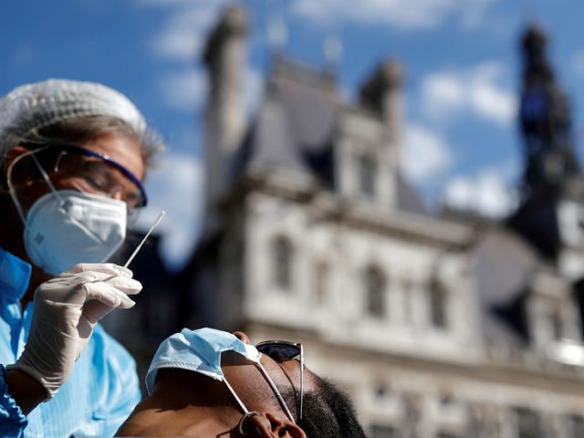 Public health state of emergency declared in France over Covid, as Macron confirms city curfews