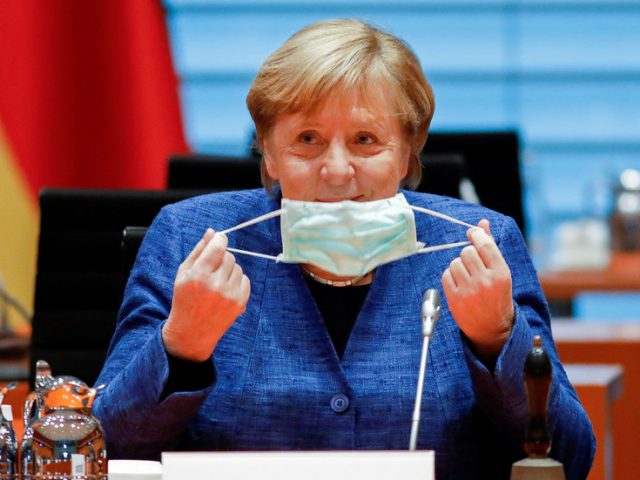 Merkel agrees stricter anti-coronavirus measures with German mayors