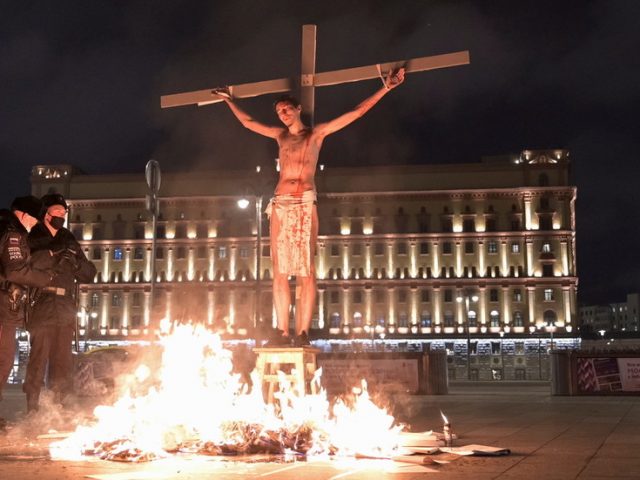 Scorching savior: Russian activist faces a month in jail after fiery crucifixion stunt outside Moscow’s FSB headquarters