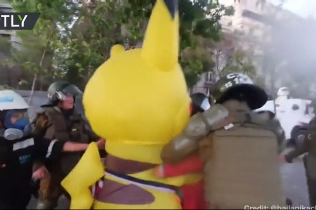 WATCH Chilean cops tackle and pepper-spray protester in Pikachu costume during demonstration in Santiago