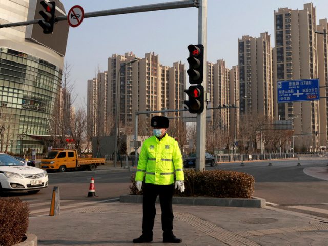 Beijing back in partial lockdown after new coronavirus cases emerge in airport district