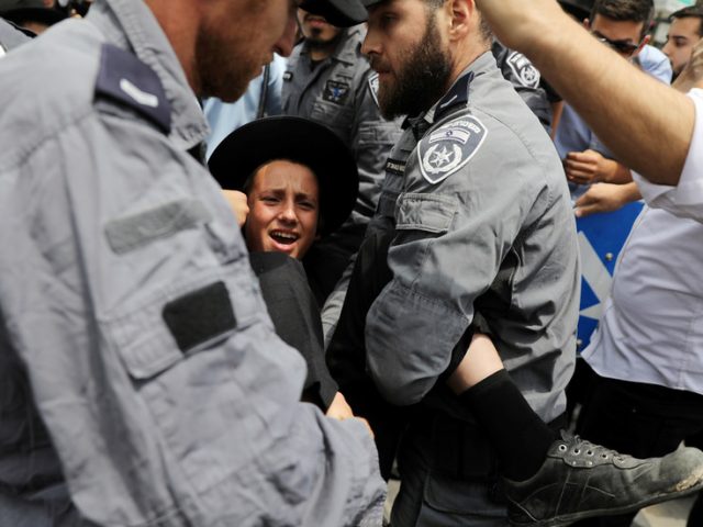 Israeli police commander indicted for assault on youngster during ultra-Orthodox protest against Covid restrictions