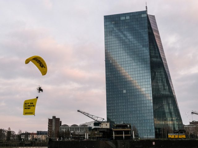 WATCH Greenpeace activists paraglide onto European Central Bank building in fossil fuel protest
