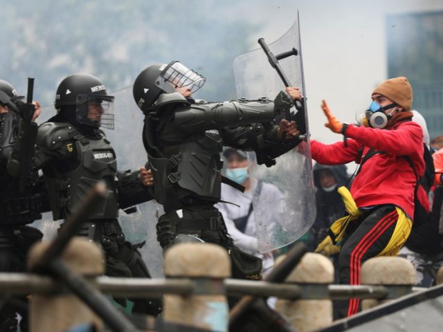 ‘Stop the massacre’: Colombia tax protests continue after more than a dozen people DIE in clashes with police