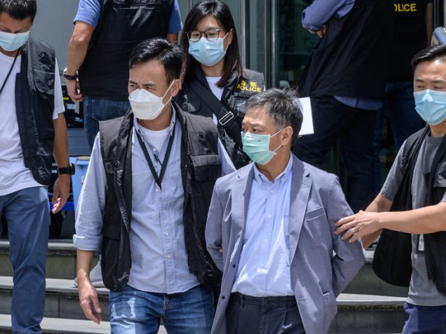 Hong Kong police charge 2 people with ‘collusion with a foreign country’ after arrests at Apple Daily newspaper