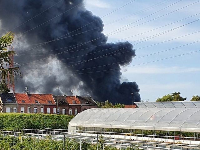 Massive column of smoke visible for MILES as huge fire rages through warehouse in northern France (VIDEOS)