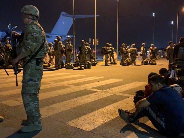 Macron ‘cannot guarantee’ evacuation of French citizens waiting aboard 20 buses in Kabul after dual explosions near airport