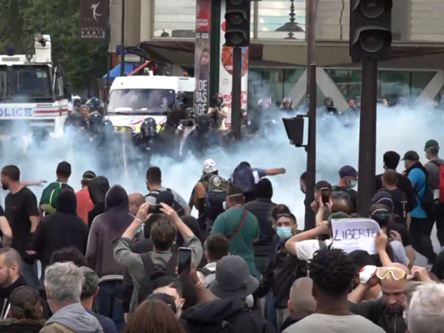 Water cannon v burning barricades: Paris protests against Covid ID turn violent as France resists measure