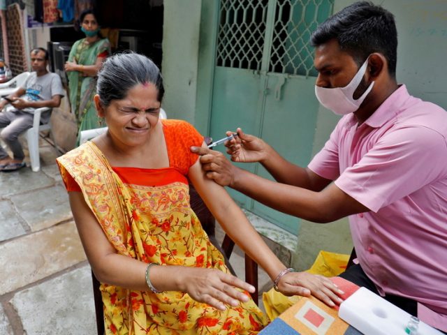 India celebrates landmark 1 BILLION Covid vaccinations, but millions still have yet to receive first dose