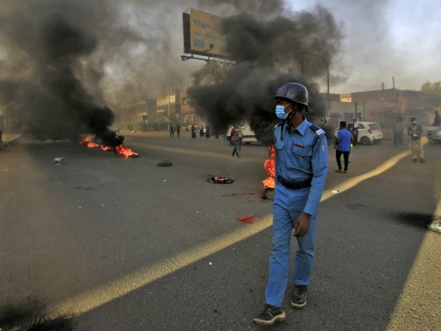 Sudanese police use tear gas as pro-military protesters try to block key roads in Khartoum