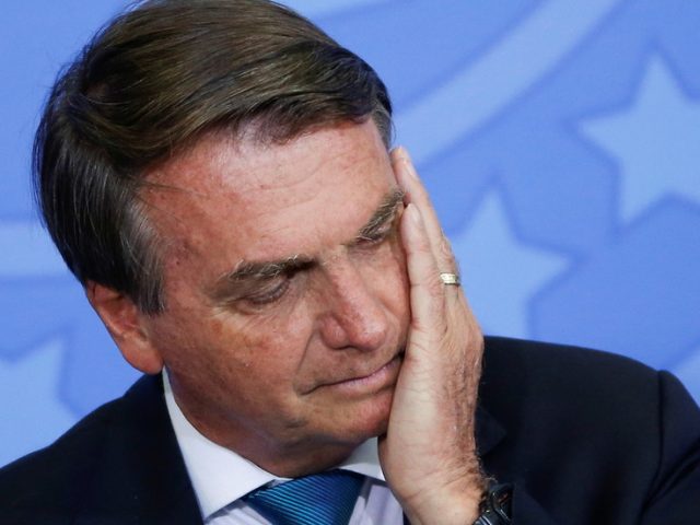 Brazilian senators vote to charge President Jair Bolsonaro with crimes against humanity for his handling of Covid pandemic